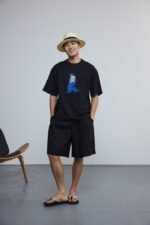 Style 88067 black relaxed graphic T-shirt, model front view